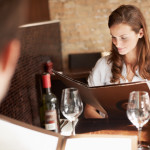 young woman browsing through a menu